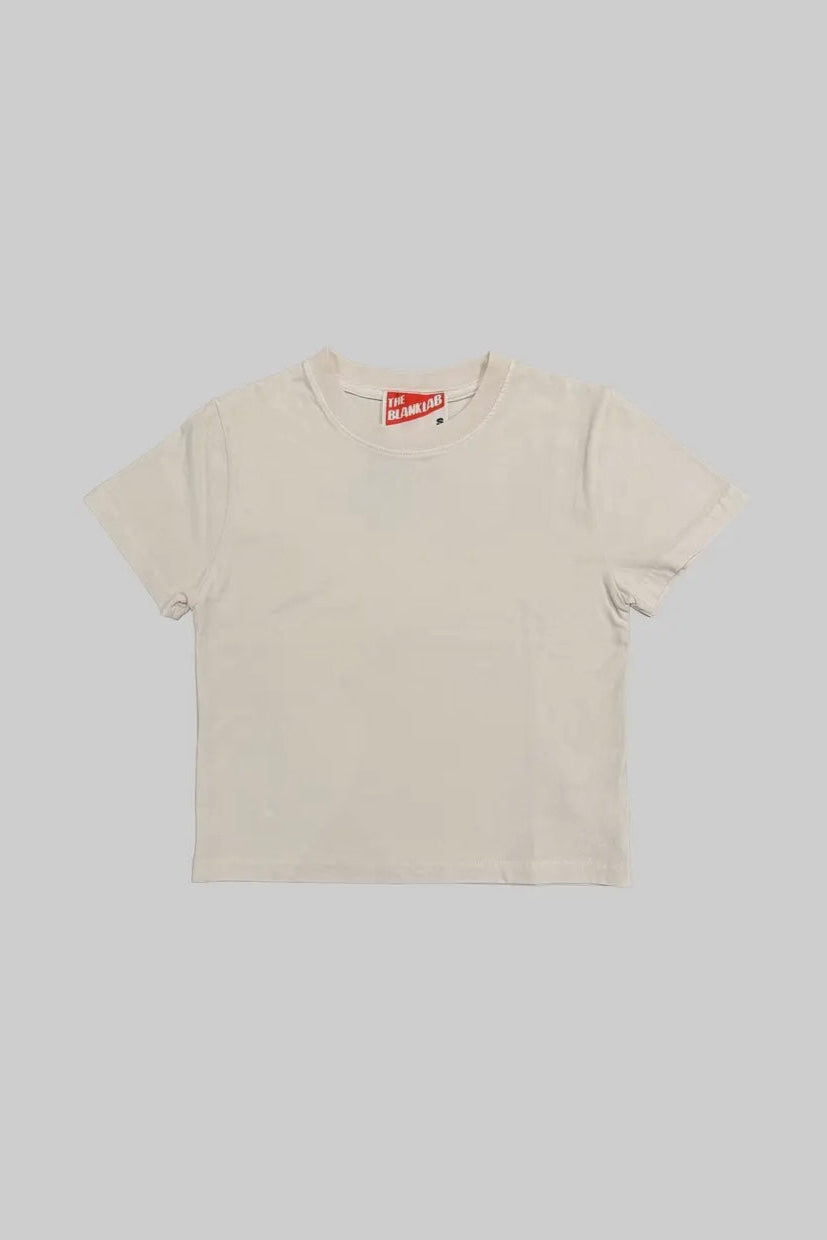 Beige t-shirt with a red and white logo on a light gray background
