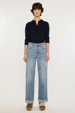 Load image into Gallery viewer, Person wearing a navy sweater and light blue jeans on a white background