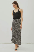 Load image into Gallery viewer, Woman wearing a black tank top and floral skirt against a white background