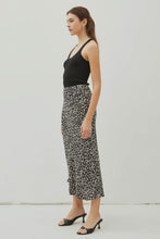 Load image into Gallery viewer, Woman wearing a black tank top and floral skirt against a white background