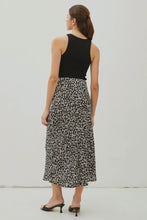 Load image into Gallery viewer, Woman wearing a black floral skirt and black top on a white background