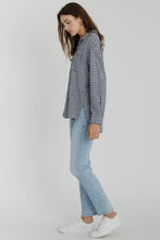 Load image into Gallery viewer, Woman wearing a checkered shirt, light blue jeans, and white sneakers on a white background