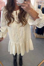 Load image into Gallery viewer, Person wearing a white lace dress in a store setting
