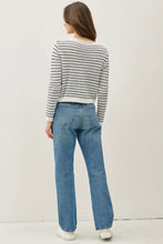 Load image into Gallery viewer, Person wearing a striped sweater and blue jeans on a plain background