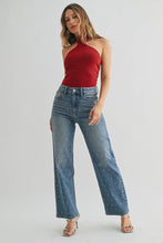 Load image into Gallery viewer, Woman wearing a red top and blue jeans on a white background