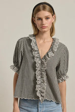 Load image into Gallery viewer, Woman wearing a checkered blouse with ruffled details on a plain background