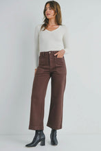 Load image into Gallery viewer, Woman wearing brown pants and a white top on a plain background