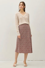 Load image into Gallery viewer, A woman modeling a cream V-neck knit sweater and a dusty rose floral midi skirt, standing against a plain off-white studio background.