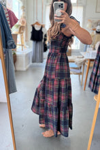 Load image into Gallery viewer, Person wearing a plaid dress in a room with a mirror.