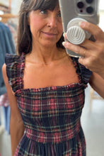Load image into Gallery viewer, Woman taking a mirror selfie wearing a plaid dress in a clothing store.