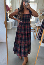 Load image into Gallery viewer, Person wearing a plaid dress in a room with a mirror reflection.