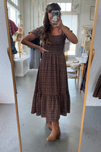 Load image into Gallery viewer, Person wearing a brown plaid dress taking a mirror selfie.