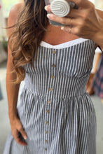 Load image into Gallery viewer, Woman wearing a striped dress with buttons taking a mirror selfie.