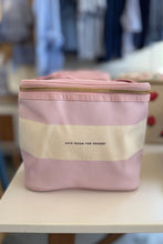 Load image into Gallery viewer, A pink and cream striped cosmetic bag with a gold zipper and the text 'SAVE ROOM FOR DESERT' printed on the front, sitting on a white table in a store setting.