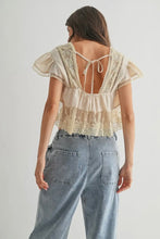 Load image into Gallery viewer, Woman wearing a lace top and jeans on a plain background
