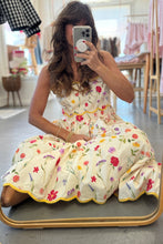 Load image into Gallery viewer, Woman taking a mirror selfie wearing a floral dress in a store.