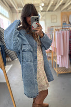 Load image into Gallery viewer, Woman taking a mirror selfie wearing a denim jacket in a clothing store.