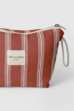 Load image into Gallery viewer, Striped pouch with &#39;De La Mur&#39; label on a light gray background