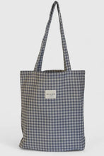 Load image into Gallery viewer, Plaid tote bag with a visible brand label on a light gray background