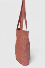 Load image into Gallery viewer, Striped tote bag with a visible brand logo on a light gray background