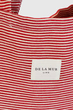Load image into Gallery viewer, Red and white striped bag with a visible brand label on a white background