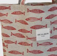 Load image into Gallery viewer, Tote bag with red fish pattern and &#39;De La Mur&#39; label on beige background