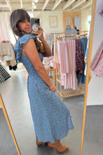 Load image into Gallery viewer, Woman taking a mirror selfie wearing a blue dress in a clothing store.