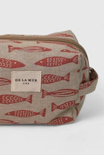 Load image into Gallery viewer, Cosmetic bag with red fish pattern and &#39;DELA MUR&#39; label on a white background