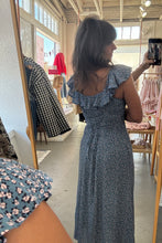 Load image into Gallery viewer, Person taking a mirror selfie wearing a blue patterned dress in a store.
