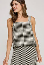 Load image into Gallery viewer, Woman wearing a black and white checkered top and skirt on a plain background