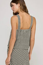 Load image into Gallery viewer, Woman wearing a black and white checkered dress against a plain background