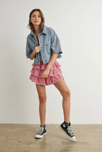 Load image into Gallery viewer, Woman wearing a denim jacket, pink skirt, and black sneakers on a plain background