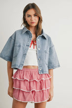Load image into Gallery viewer, Woman wearing a denim jacket, white top, and red checkered skirt on a light gray background