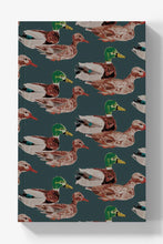 Load image into Gallery viewer, A rectangular canvas wall art print featuring a repeating pattern of mallard ducks on a dark teal background, shown against a light gray wall with a soft drop shadow.