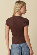 Load image into Gallery viewer, A woman shown from the back wearing a fitted short-sleeve brown t-shirt and blue jeans, standing against a plain beige studio background.