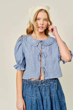 Load image into Gallery viewer, Woman wearing a blue denim top and skirt with a beige hat on a plain background