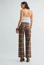 Load image into Gallery viewer, A woman shown from the back wearing brown plaid wide-leg trousers, a white strapless tube top, and brown block-heel mules against a light gray studio background.