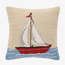 Load image into Gallery viewer, A square beige needlepoint throw pillow featuring a hand-knotted sailboat design with white sails, a red hull, and blue wavy water at the bottom, shown against a plain white background.