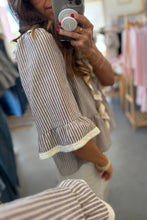 Load image into Gallery viewer, Person wearing a striped dress in a store setting