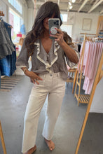 Load image into Gallery viewer, Woman taking a mirror selfie wearing a striped shirt and white pants in a clothing store.