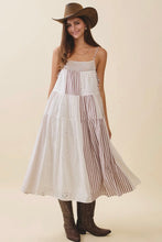 Load image into Gallery viewer, Woman wearing a white dress with striped layers, brown cowboy hat, and boots on a beige background