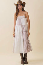 Load image into Gallery viewer, Woman wearing a white dress with red stripes, brown cowboy hat, and boots on a beige background