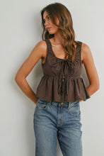 Load image into Gallery viewer, Woman wearing a brown checkered top and blue jeans against a plain background