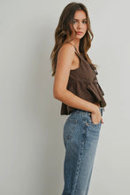 Load image into Gallery viewer, Woman wearing a brown patterned top and blue jeans against a plain background