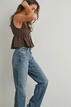 Load image into Gallery viewer, Woman wearing a brown sleeveless top and blue jeans against a plain background