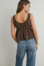 Load image into Gallery viewer, Woman wearing a brown checkered top and blue jeans on a plain background
