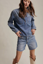 Load image into Gallery viewer, Woman wearing a denim shirt and shorts on a plain background