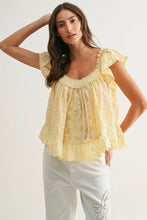 Load image into Gallery viewer, Woman wearing a yellow lace top and white pants on a plain background