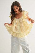 Load image into Gallery viewer, Woman wearing a yellow lace top and white pants on a light background