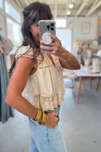 Load image into Gallery viewer, Woman taking a mirror selfie wearing a lace top and jeans in a store.